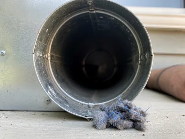 Rancho Palos Verdes Dryer Vent Cleaning technician using specialized equipment to clear severe dryer vent blockage in Rancho Palos Verdes